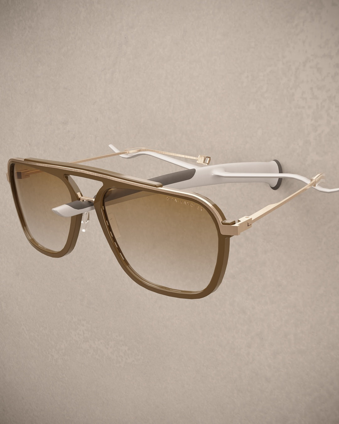 Sunglasses with gold frame and gradient lenses on an Eyewear holder