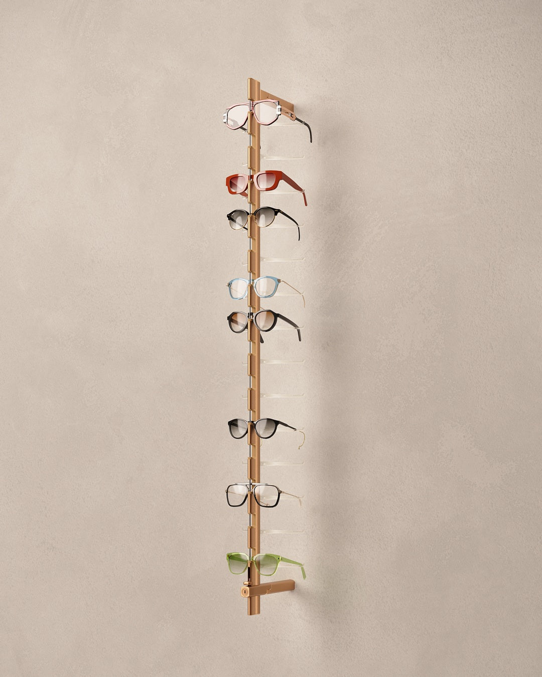 Copper coloured Eyewear rod with multiple pairs of eyeglasses on a beige background