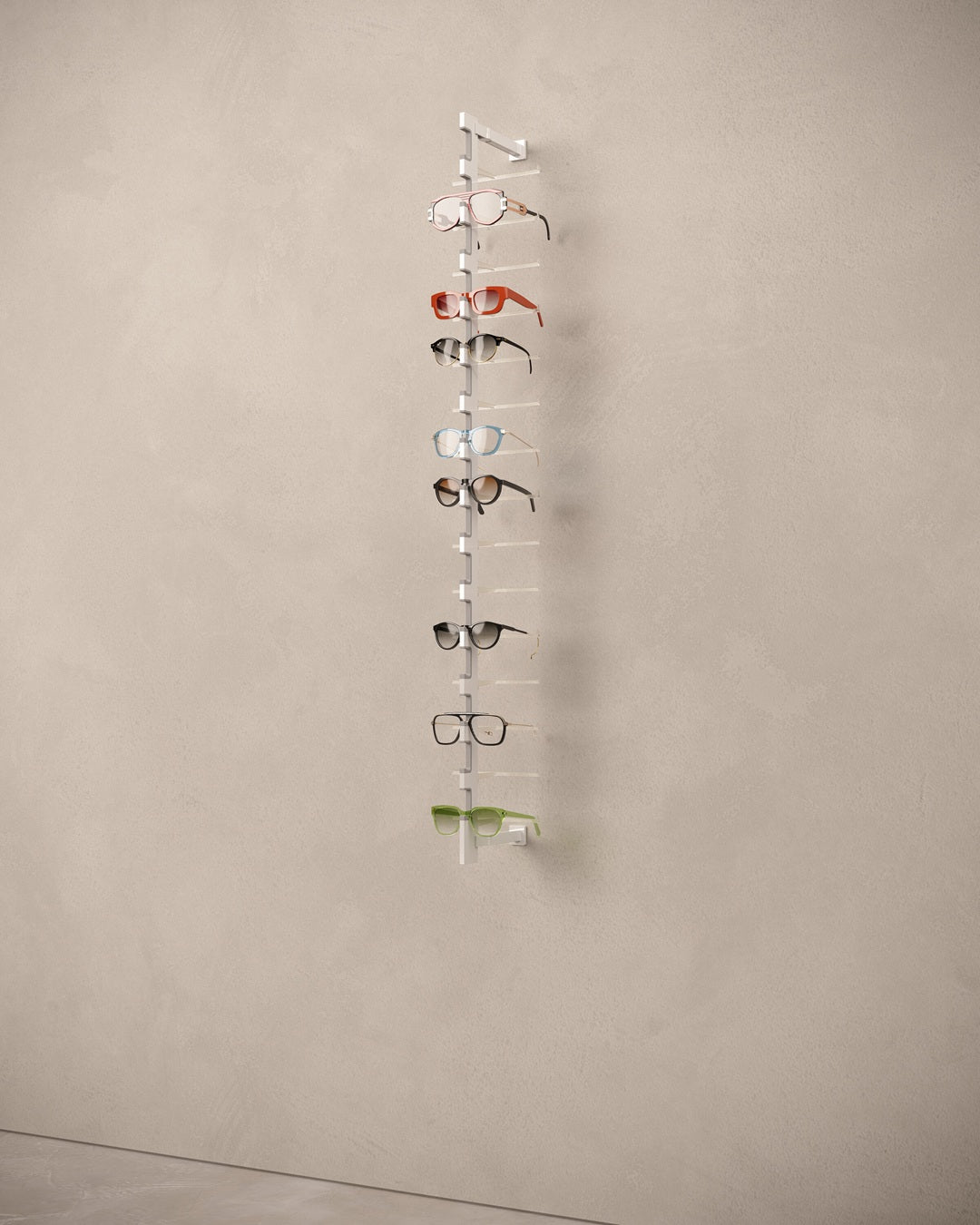 Vertical eyewear rod with multiple pairs of glasses on a beige wall.