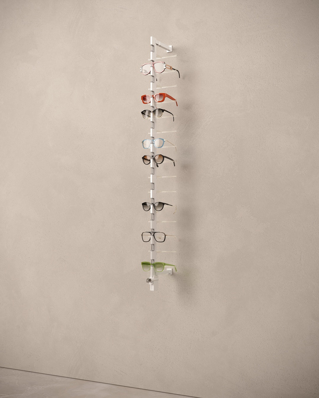 Glasses display rack with multiple pairs of eyeglasses on a beige wall.