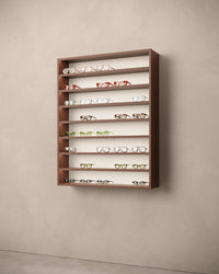 Willuminated cabinet for sunglasses with LED on a beige wall