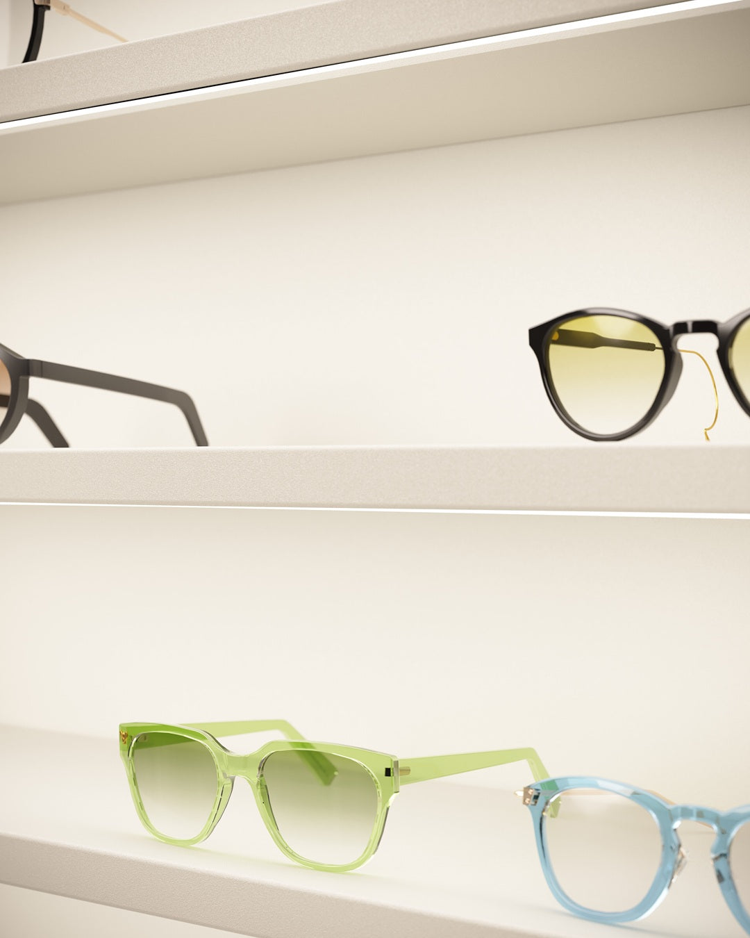 Collection of colorful sunglasses on an illuminated display for eyeglasses