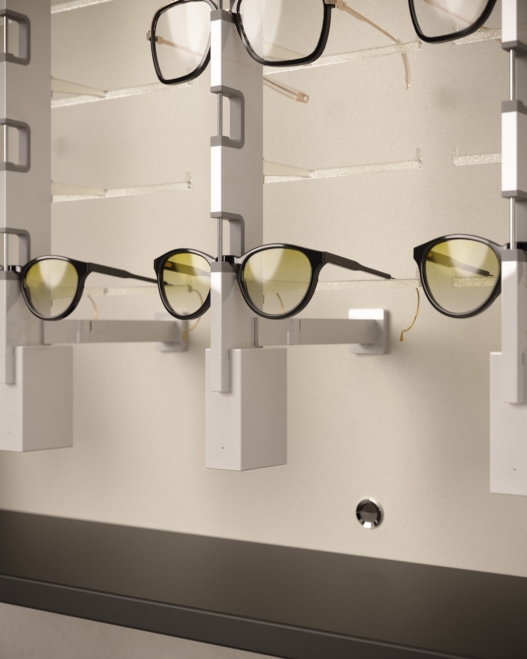 Eyeglasses displayed on a wall mount Sunglasses presentation cabinet against a neutral background