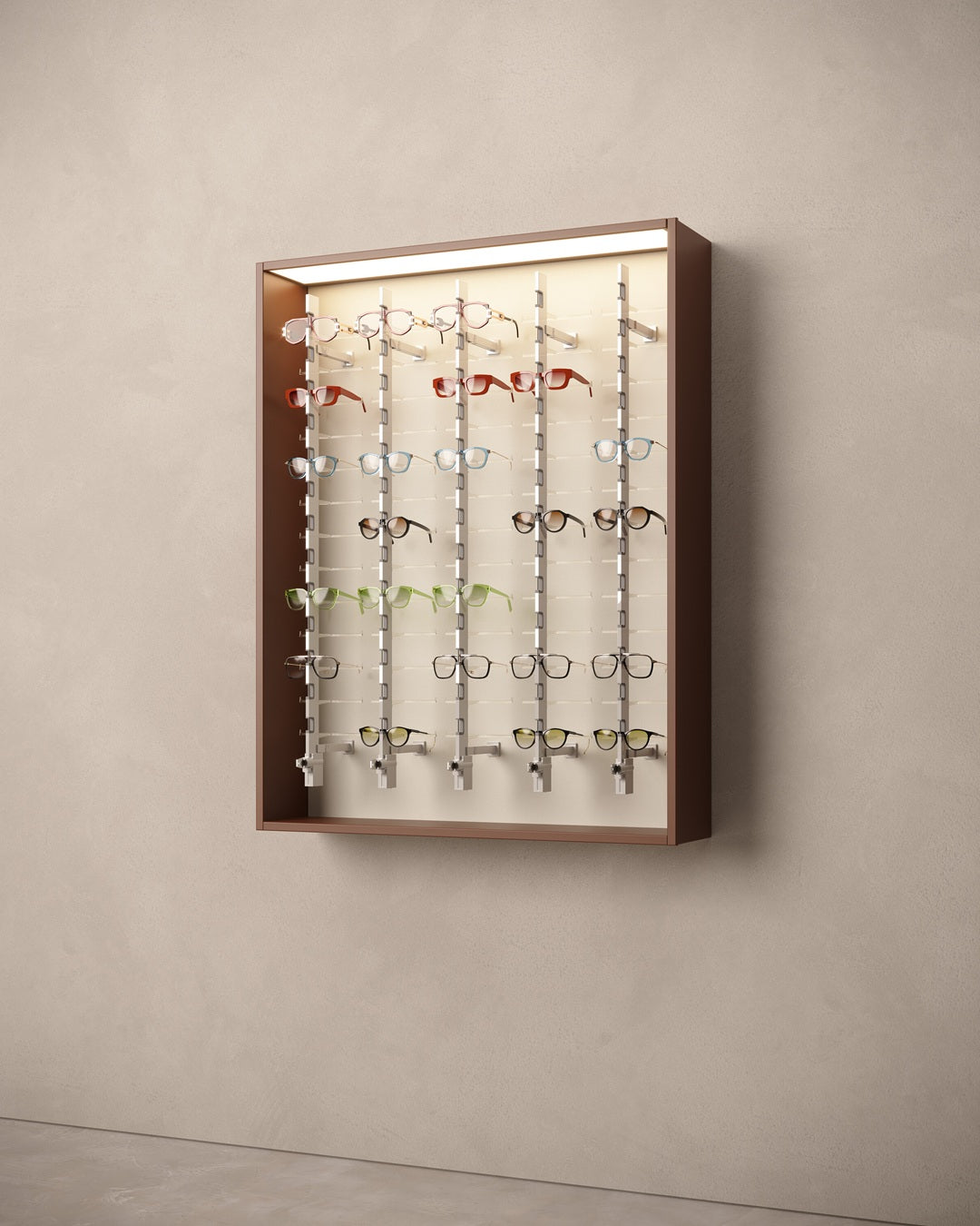 Wall-mounted cabinet for glasses with various eyeglasses on a beige wall.
