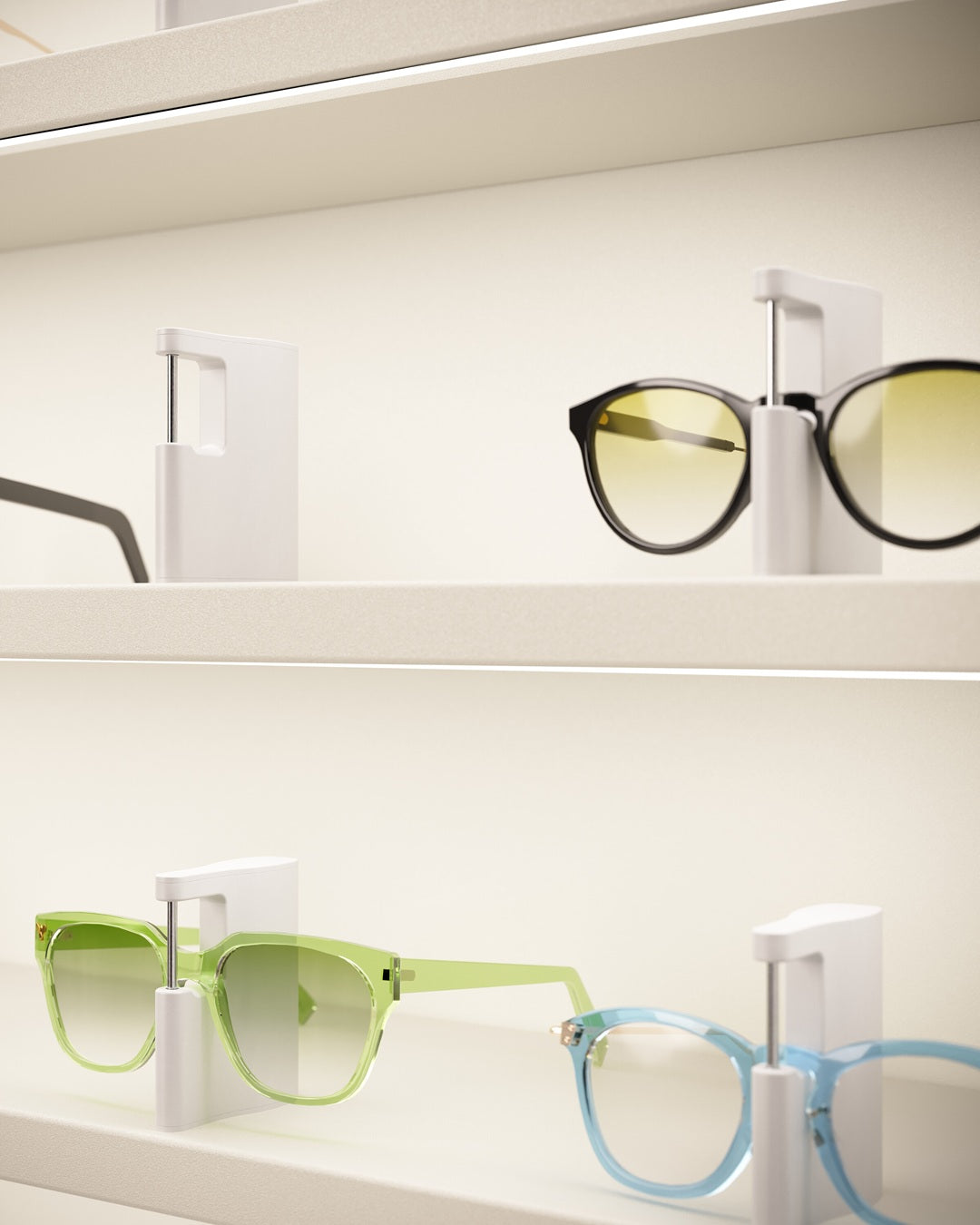 Eyewear cabinet display with various glasses on LED shelves.