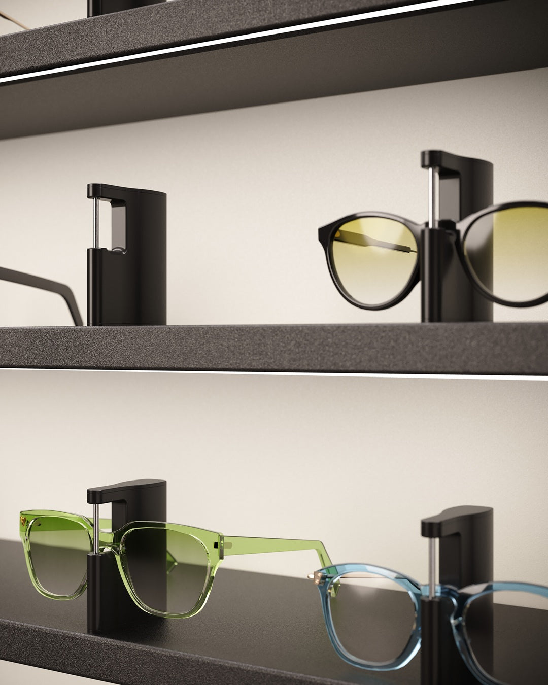 Eyewear cabinet display with various glasses on black LED shelves.